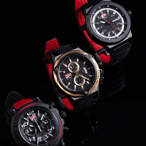 trio of red and black Ducati watches