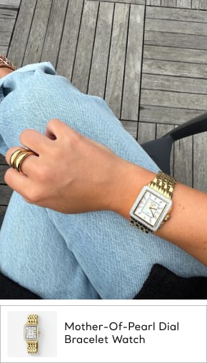 woman wearing gold pearl watch