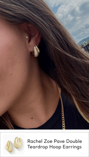 woman wearing cz gold earrings