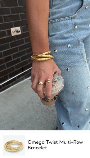 woman wearing set stretchy gold bracelets