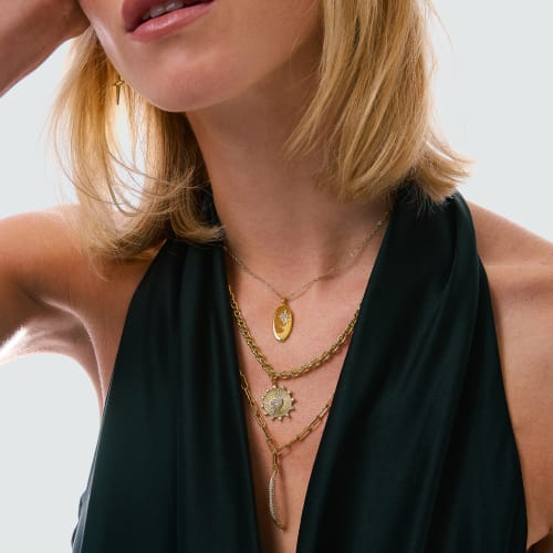 woman wearing charm jewelry
