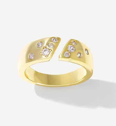 gold bypass ring with small white stones 
