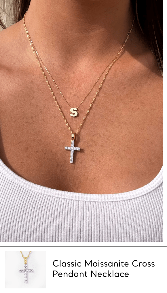 woman wearing moissanite cross pendant