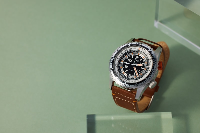 a gevril dive watch with a brown leather strap 