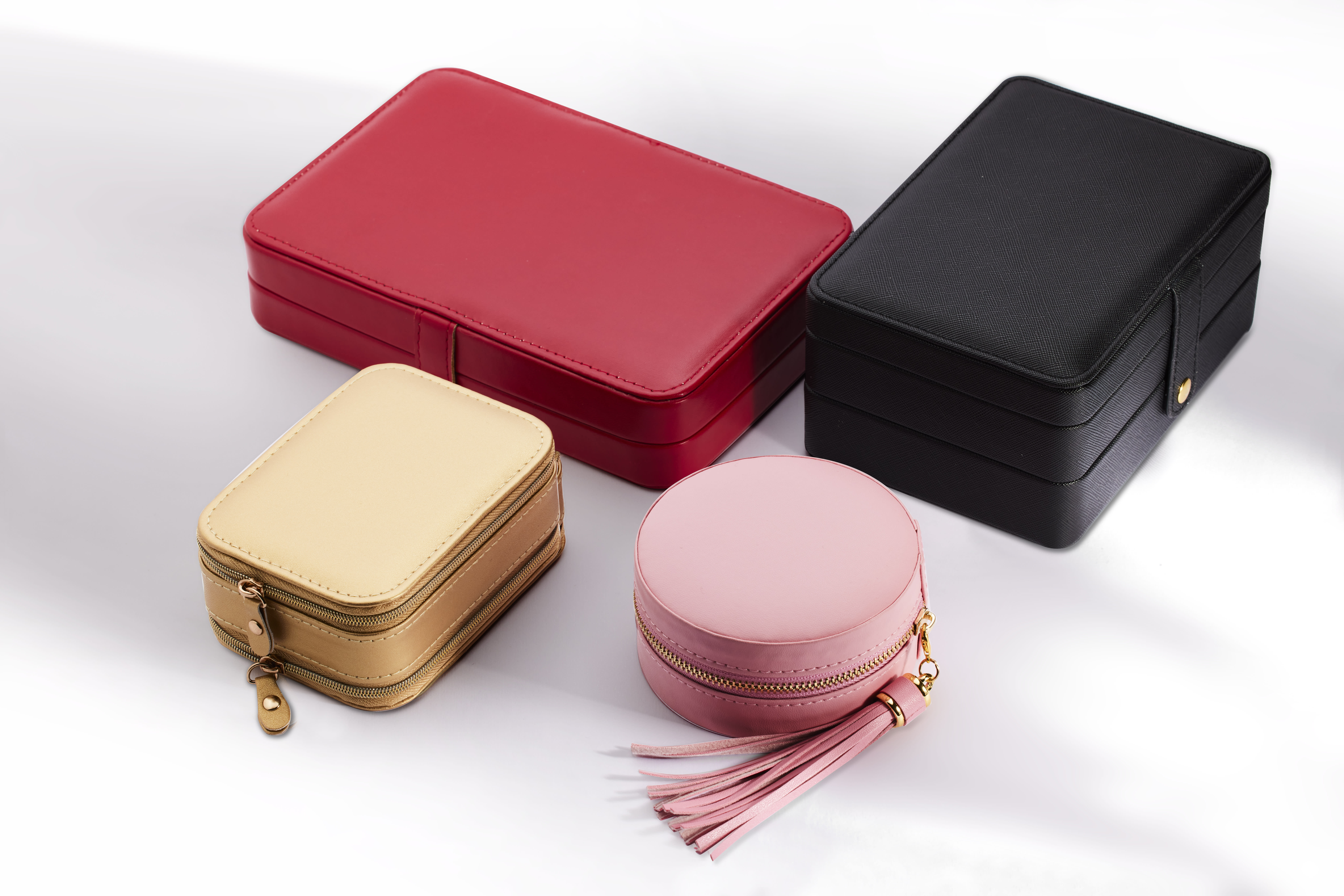 red, black, beige and pink jewelry storage boxes 