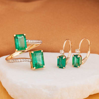 emerald and diamond drop earrings and multi-row emerald ring 