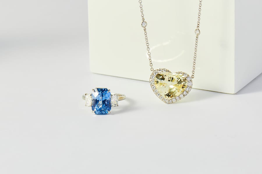 In platinum, a blue sapphire ring and a yellow sapphire pendant 