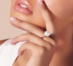 woman wearing pearl ring