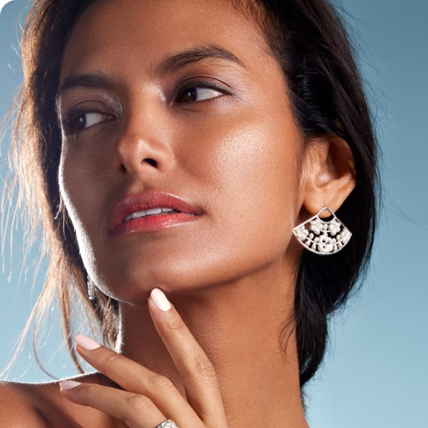woman wearing fashionable earrings