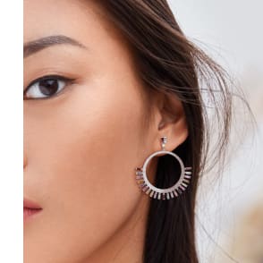 woman wearing hoop earrings