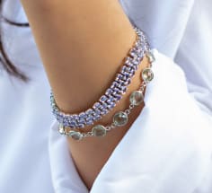woman wearing colorful gemstone bracelets