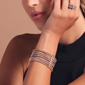 woman wearing gold and silver cuff bracelet