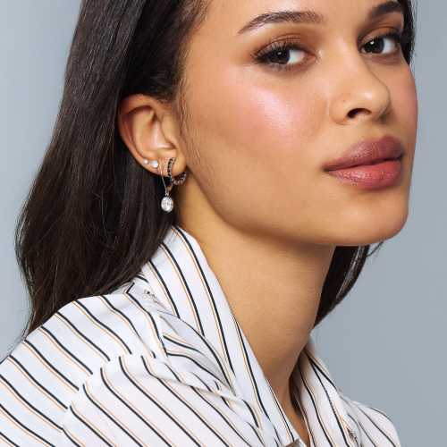 woman wearing earring stack