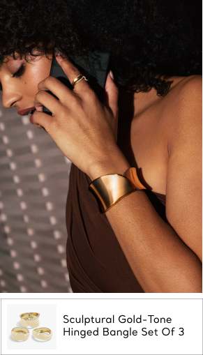 woman wearing gold bangle bracelet