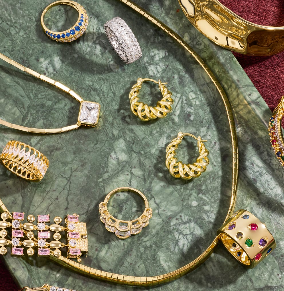 Bold hoop earrings and cocktail rings