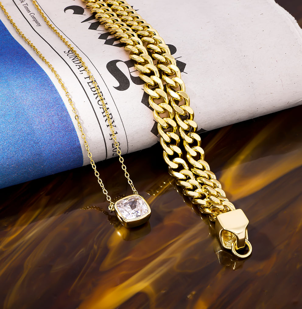 simple chain necklace next to a simple pendant necklace