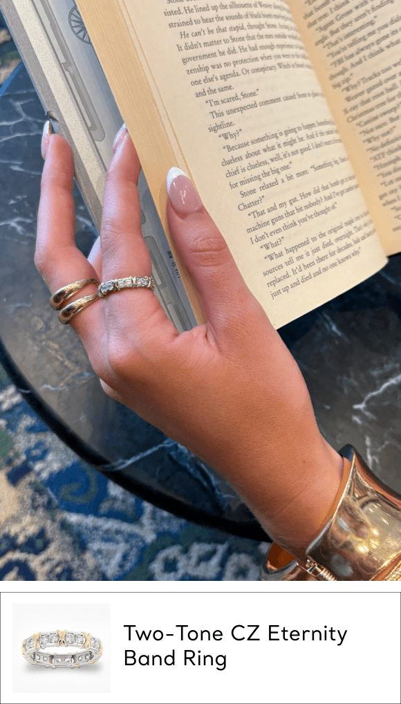 woman wearing two tone cz band ring