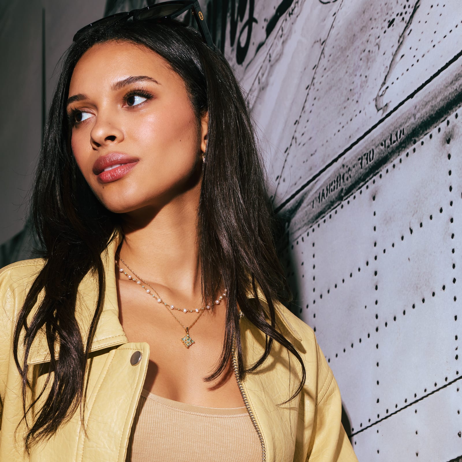 woman wearing layered necklaces 
