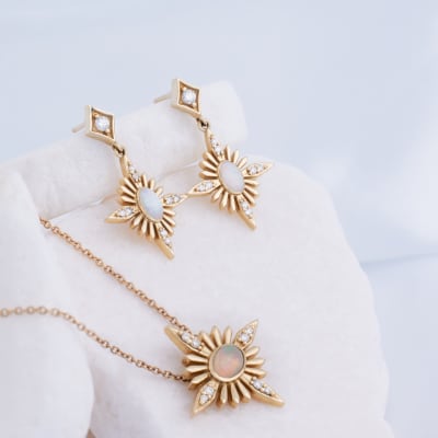 A matching set of opal earrings and a necklace