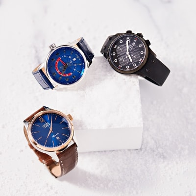 a group of three men's gevril watches 
