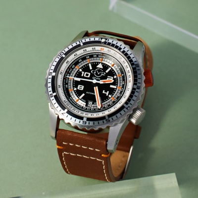 brown leather watch with silver dial 