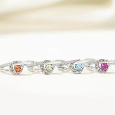 silver rings with red, blue, yellow and green gemstones 