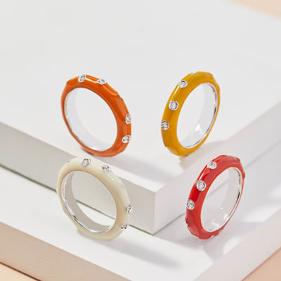 Four orange and yellow band rings