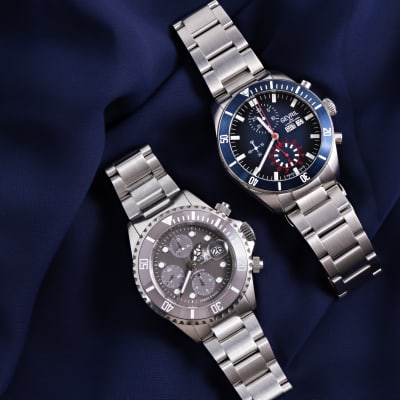 silver Gevril watches black and navy dials 