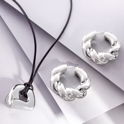 silver hoop earrings and silver pendant on black leather cord