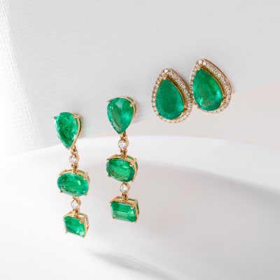 emerald dangle and emerald teardrop stud earrings in yellow gold 