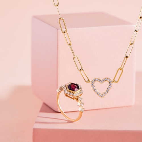 pink rhodolite and diamond ring and paperclip gold chain with white topaz heart pendant