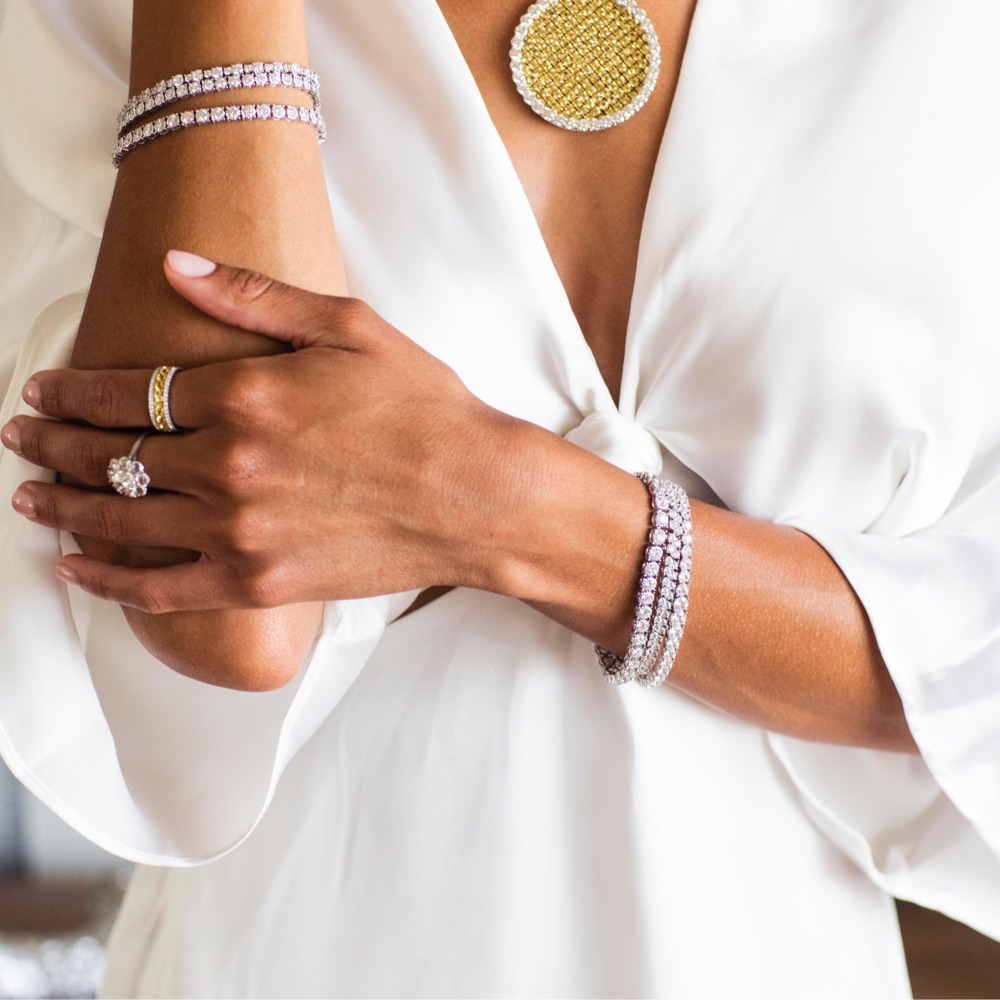 woman wearing diamond tennis bracelets 