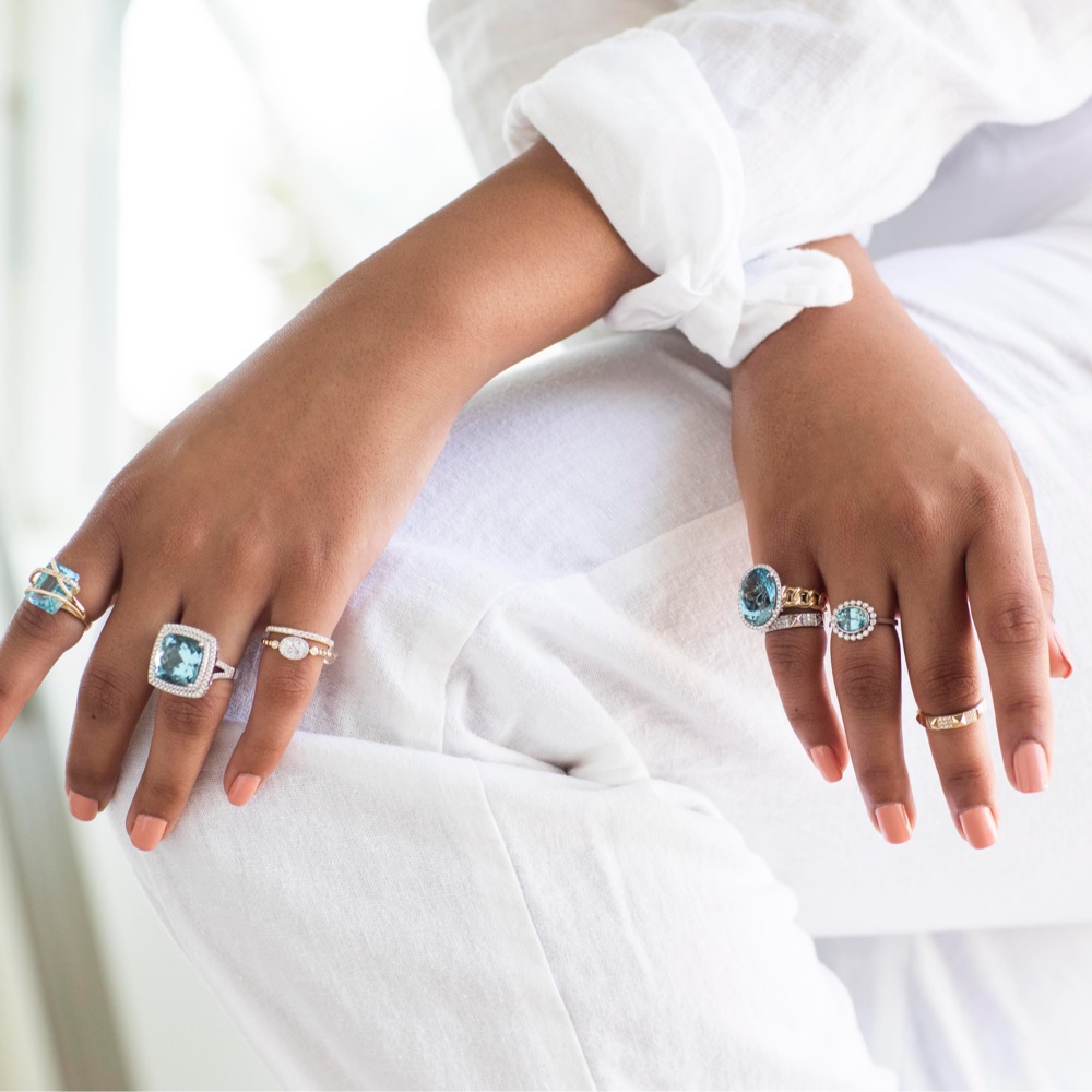 model wearing aquamarine rings 