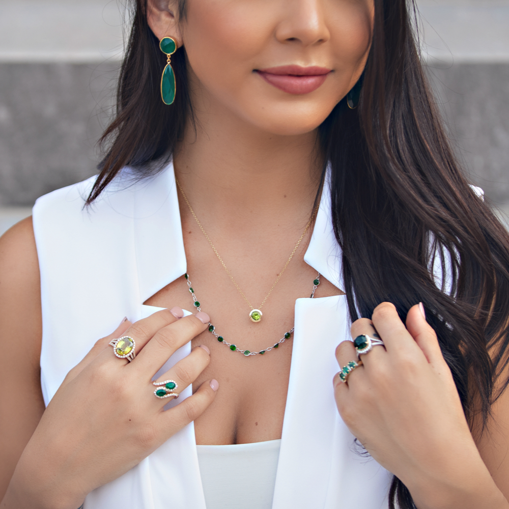 Woman wearing green gemstone jewelry 