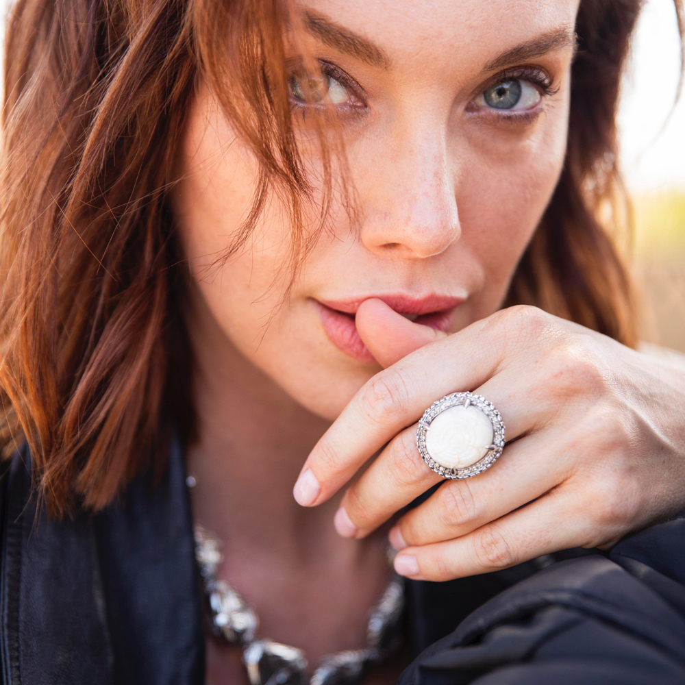 Woman Wearing White Mother of Pearl Ring 