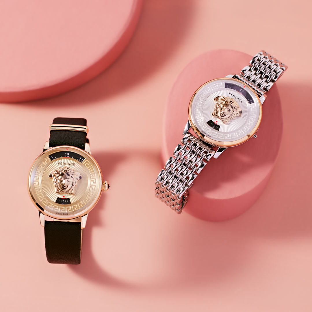 Two Watches on Pink Background 
