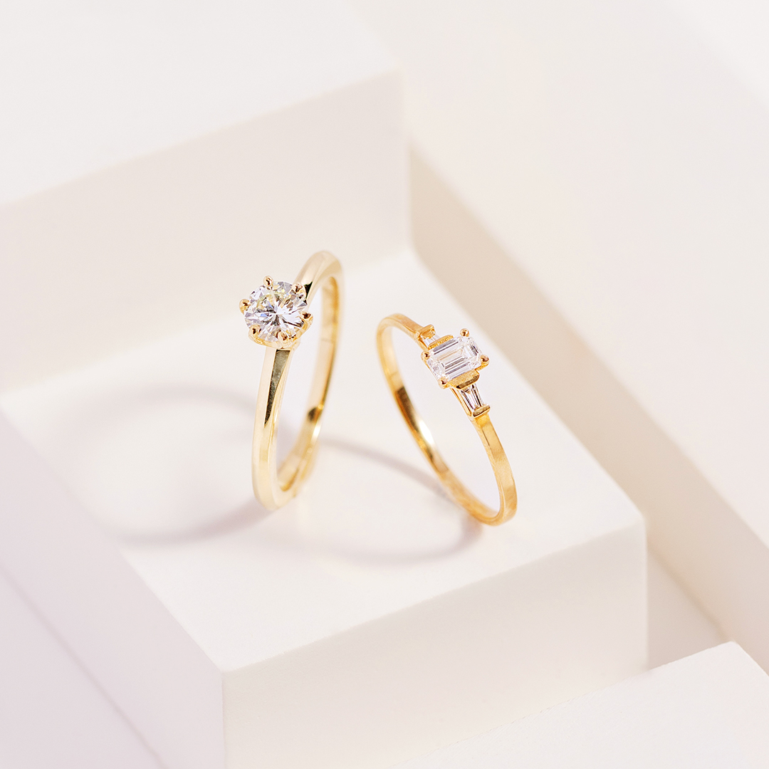 two gold engagement rings 