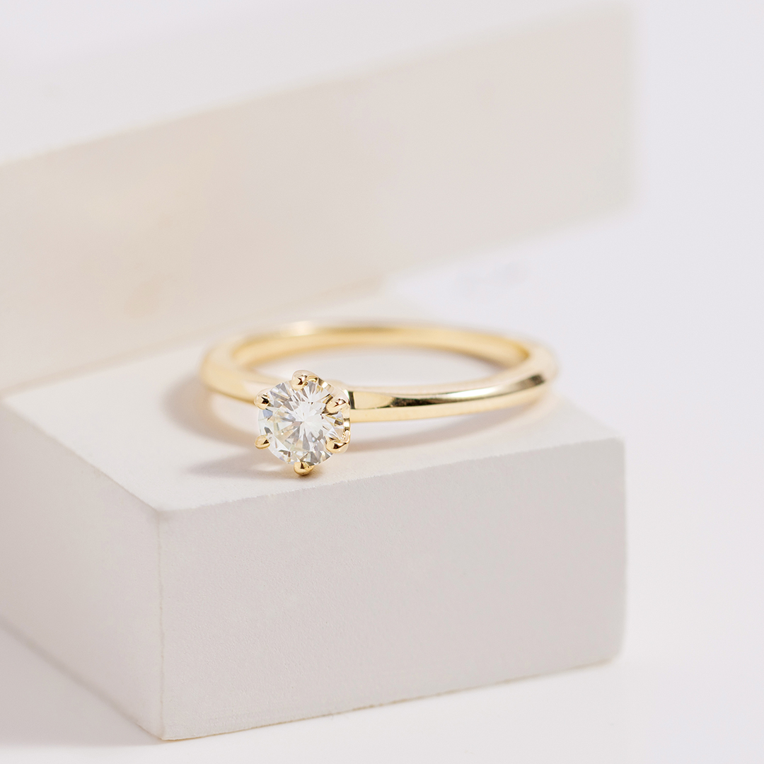gold round brilliant engagement ring 