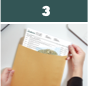 Man placing a paper into an envelope 